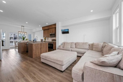 203-33 Merganser Drive, Chestermere, AB - Indoor Photo Showing Living Room
