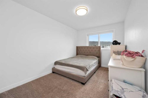 203-33 Merganser Drive, Chestermere, AB - Indoor Photo Showing Bedroom