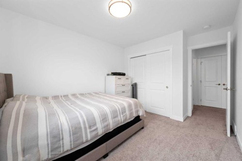 203-33 Merganser Drive, Chestermere, AB - Indoor Photo Showing Bedroom