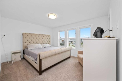 203-33 Merganser Drive, Chestermere, AB - Indoor Photo Showing Bedroom