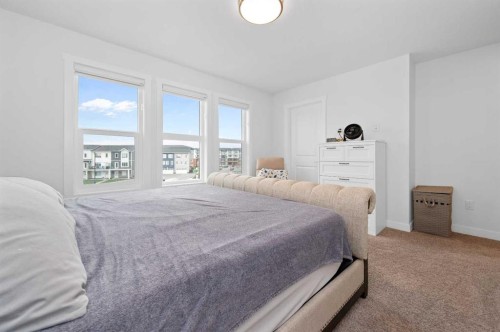 203-33 Merganser Drive, Chestermere, AB - Indoor Photo Showing Bedroom