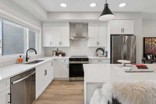 40 Emberside Grove, Cochrane, AB - Indoor Photo Showing Kitchen With Double Sink With Upgraded Kitchen