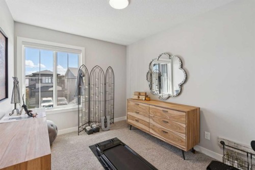 40 Emberside Grove, Cochrane, AB - Indoor Photo Showing Bedroom