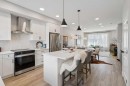 40 Emberside Grove, Cochrane, AB  - Indoor Photo Showing Kitchen With Upgraded Kitchen 