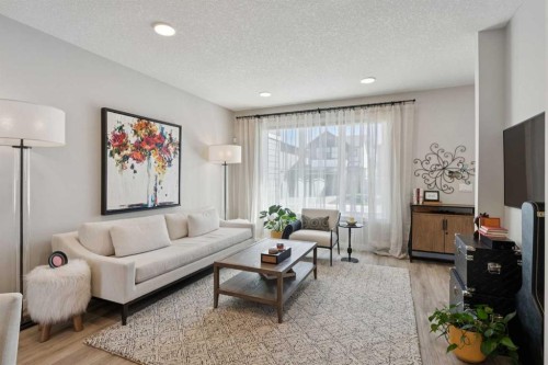 40 Emberside Grove, Cochrane, AB - Indoor Photo Showing Living Room