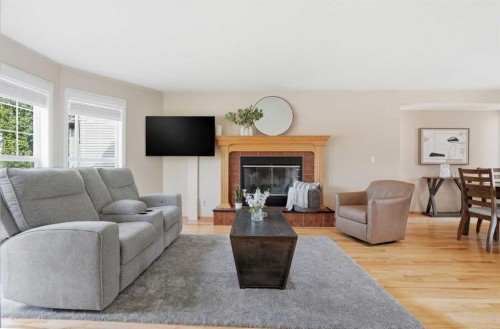 258 Cramond Circle Se, Calgary, AB - Indoor Photo Showing Living Room With Fireplace