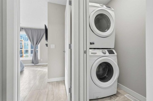 1071 Seton Circle Se, Calgary, AB - Indoor Photo Showing Laundry Room