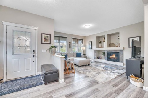 250 Prestwick Close Se, Calgary, AB - Indoor Photo Showing Other Room With Fireplace