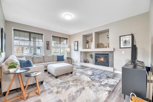 250 Prestwick Close Se, Calgary, AB - Indoor Photo Showing Living Room With Fireplace