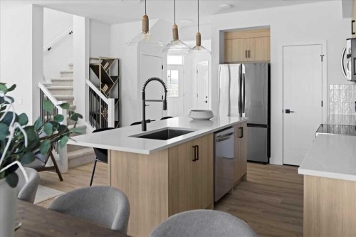 214 Greystone Boulevard, Cochrane, AB - Indoor Photo Showing Kitchen With Upgraded Kitchen