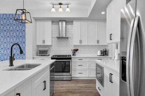 377 Masters Avenue Se, Calgary, AB - Indoor Photo Showing Kitchen With Stainless Steel Kitchen With Double Sink With Upgraded Kitchen