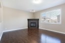 606 Montgomery Close Se, High River, AB  - Indoor Photo Showing Living Room With Fireplace 