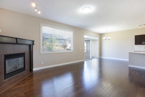606 Montgomery Close Se, High River, AB - Indoor Photo Showing Living Room With Fireplace