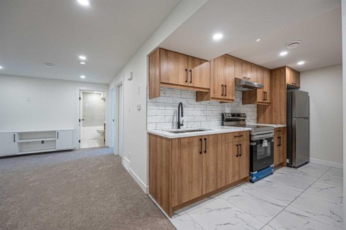 176 Huntchester Crescent Ne, Calgary, AB - Indoor Photo Showing Kitchen With Double Sink