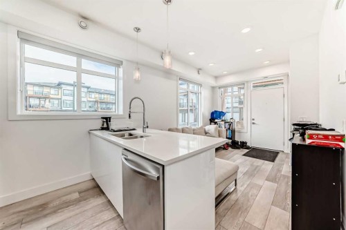 3112-410 Seton Passage Se, Calgary, AB - Indoor Photo Showing Kitchen With Double Sink