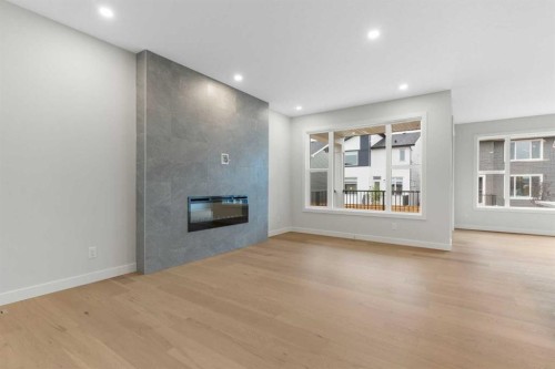 125 Southborough Common, Cochrane, AB - Indoor With Fireplace