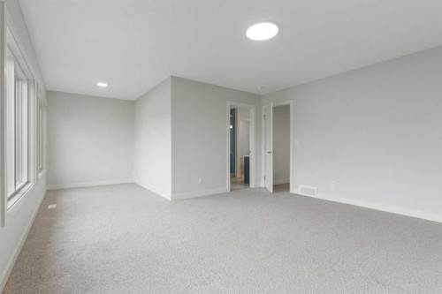 125 Southborough Common, Cochrane, AB - Indoor Photo Showing Other Room