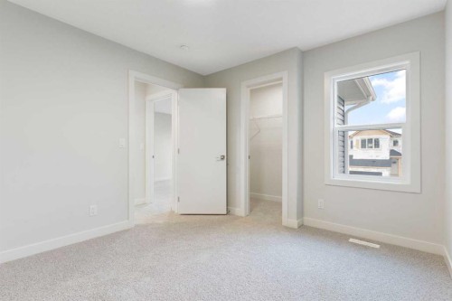 125 Southborough Common, Cochrane, AB - Indoor Photo Showing Other Room