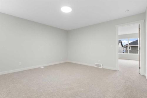 125 Southborough Common, Cochrane, AB - Indoor Photo Showing Other Room