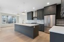125 Southborough Common, Cochrane, AB  - Indoor Photo Showing Kitchen With Stainless Steel Kitchen With Upgraded Kitchen 