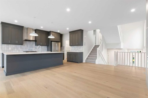 125 Southborough Common, Cochrane, AB - Indoor Photo Showing Kitchen With Upgraded Kitchen