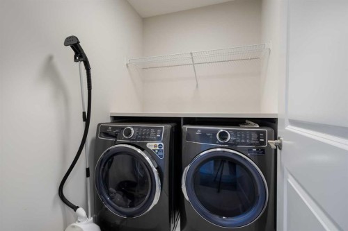 61 Rowmont Heath Nw, Calgary, AB - Indoor Photo Showing Laundry Room