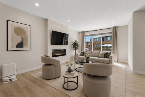 61 Rowmont Heath Nw, Calgary, AB - Indoor Photo Showing Living Room With Fireplace