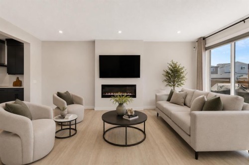 61 Rowmont Heath Nw, Calgary, AB - Indoor Photo Showing Living Room With Fireplace