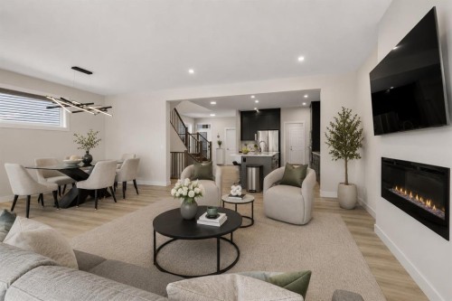 61 Rowmont Heath Nw, Calgary, AB - Indoor Photo Showing Living Room With Fireplace