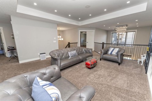 249 Kinniburgh Boulevard, Chestermere, AB - Indoor Photo Showing Living Room