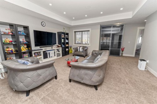 249 Kinniburgh Boulevard, Chestermere, AB - Indoor Photo Showing Living Room