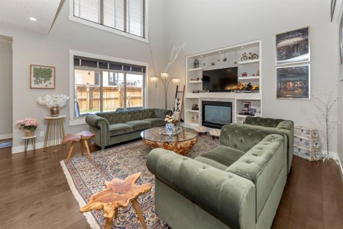 249 Kinniburgh Boulevard, Chestermere, AB - Indoor Photo Showing Living Room With Fireplace