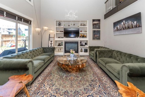 249 Kinniburgh Boulevard, Chestermere, AB - Indoor Photo Showing Living Room