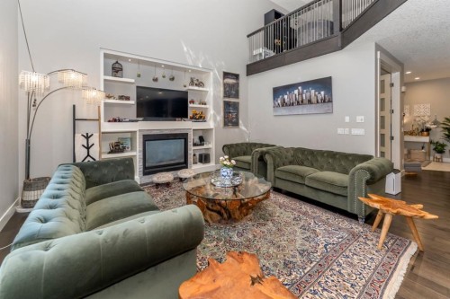 249 Kinniburgh Boulevard, Chestermere, AB - Indoor Photo Showing Living Room With Fireplace