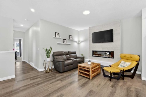 1949 Mahogany Boulevard Se, Calgary, AB - Indoor Photo Showing Living Room With Fireplace
