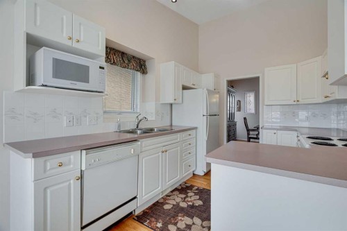 58 Evergreen Bay Sw, Calgary, AB - Indoor Photo Showing Kitchen With Double Sink
