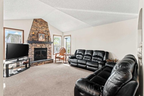 90 New Brighton Manor Se, Calgary, AB - Indoor Photo Showing Living Room With Fireplace