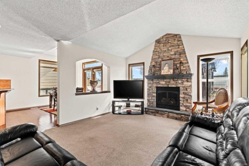 90 New Brighton Manor Se, Calgary, AB - Indoor Photo Showing Living Room With Fireplace