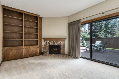 152 Coach Grove Place Sw, Calgary, AB - Indoor With Fireplace