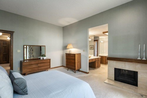 152 Coach Grove Place Sw, Calgary, AB - Indoor Photo Showing Bedroom