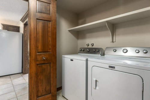152 Coach Grove Place Sw, Calgary, AB - Indoor Photo Showing Laundry Room