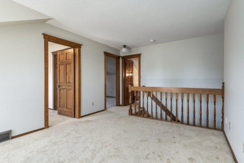 152 Coach Grove Place Sw, Calgary, AB - Indoor Photo Showing Other Room