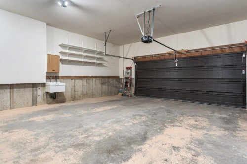 152 Coach Grove Place Sw, Calgary, AB - Indoor Photo Showing Garage