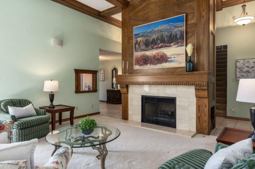 152 Coach Grove Place Sw, Calgary, AB - Indoor Photo Showing Living Room With Fireplace
