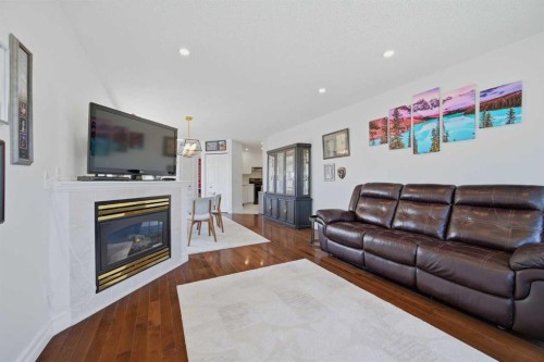 55 Ross Place, Crossfield, AB - Indoor Photo Showing Living Room With Fireplace