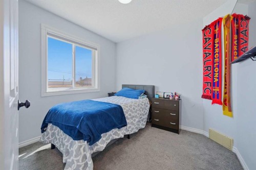 55 Ross Place, Crossfield, AB - Indoor Photo Showing Bedroom