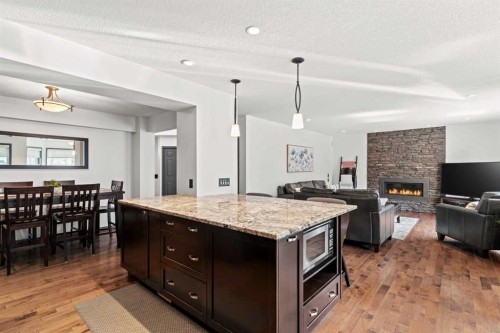 186 Mt Assiniboine Circle Se, Calgary, AB - Indoor Photo Showing Kitchen With Fireplace