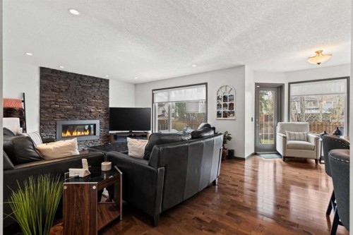 186 Mt Assiniboine Circle Se, Calgary, AB - Indoor Photo Showing Living Room With Fireplace