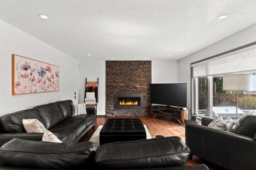 186 Mt Assiniboine Circle Se, Calgary, AB - Indoor Photo Showing Living Room With Fireplace
