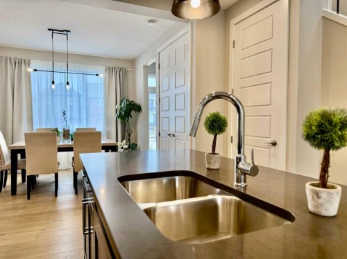 399 Sora Boulevard Se, Calgary, AB - Indoor Photo Showing Kitchen With Double Sink